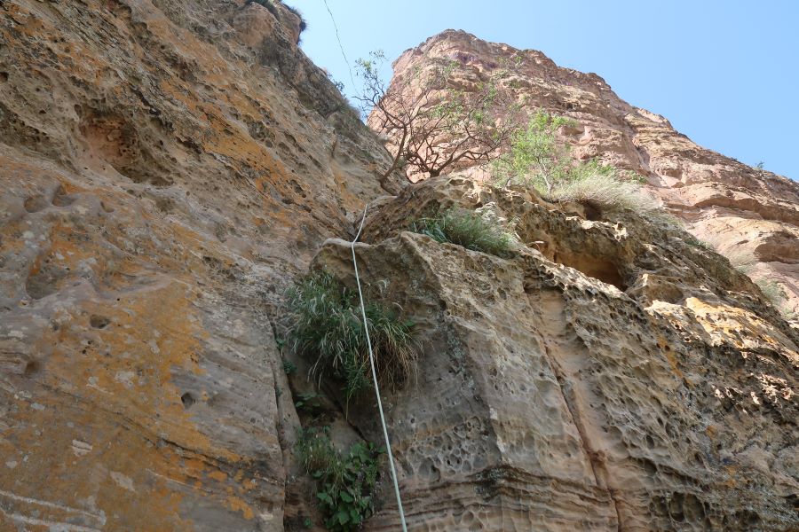 A photo showing how the climb requires using a harness and rope to reach the Abuna Yemata Guh church in the Gheralta Mountains in Tigray, North Ethiopia.